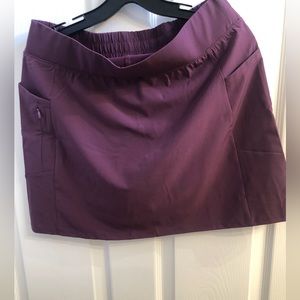 Ladies Golf/Tennis Skort. Size Medium Eggplant color 2 pockets & zipper pocket.